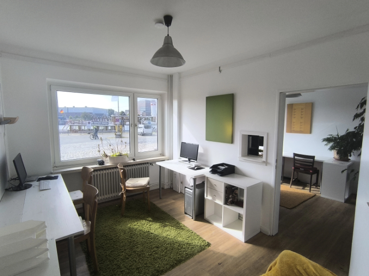 young man side profile having beard trimmed with scissors